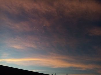 Low angle view of dramatic sky during sunset