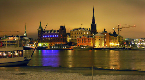 Illuminated buildings at waterfront