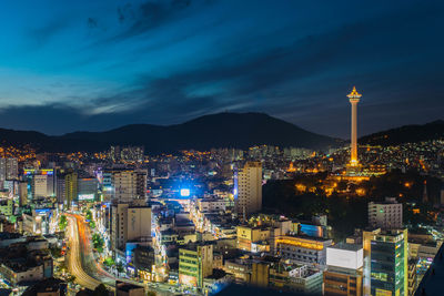 Aerial view of city lit up at night