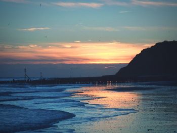 Scenic view of sea against dramatic sky