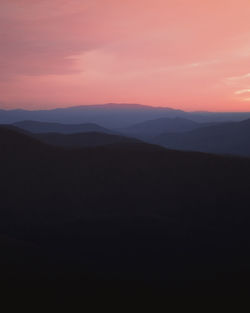 Scenic view of silhouette landscape against sky during sunset