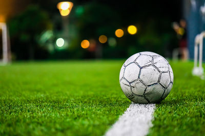 Close-up of soccer ball on field