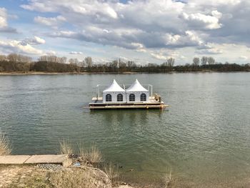 Boat in lake against sky