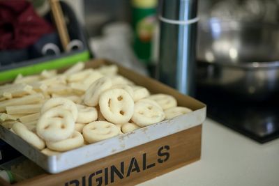 High angle view of smiley face food in container on table