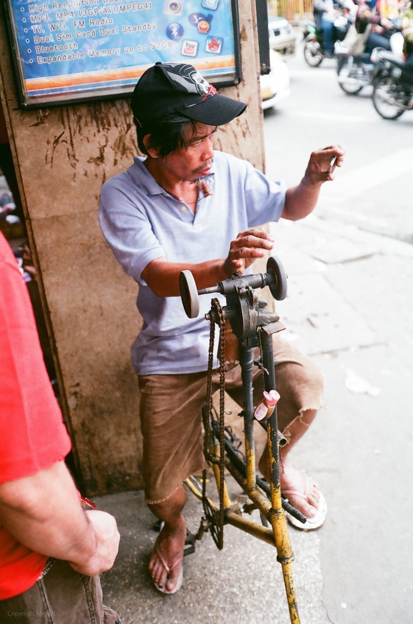 lifestyles, leisure activity, holding, casual clothing, street, men, high angle view, full length, childhood, day, person, standing, togetherness, outdoors, sidewalk, boys