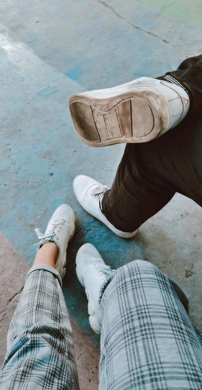 blue, human leg, shoe, footwear, low section, spring, high angle view, adult, limb, men, human limb, personal perspective, lifestyles, casual clothing, one person, leisure activity, day, clothing, jeans, outdoors, relaxation, standing, women, white, human foot