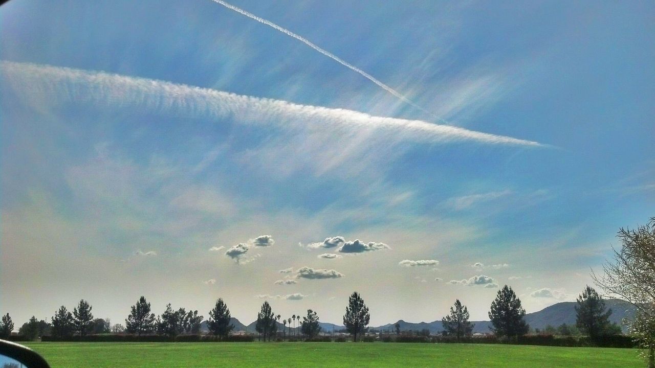 sky, tree, grass, blue, landscape, field, tranquil scene, tranquility, transportation, scenics, beauty in nature, nature, green color, cloud - sky, cloud, sunlight, grassy, day, outdoors, growth