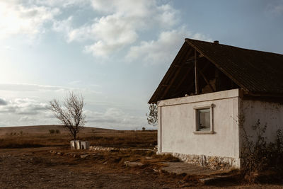 House on field against sky