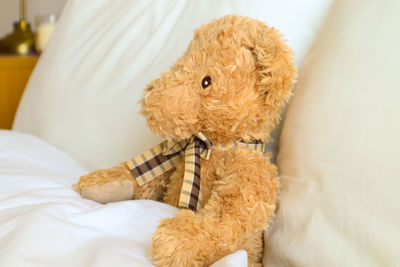Close-up of stuffed toy on bed