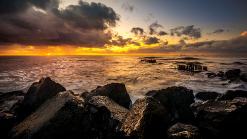 Scenic view of sea against sky during sunset