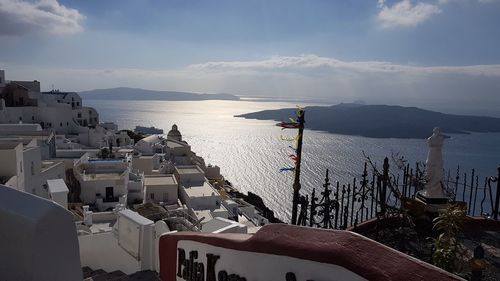 Panoramic view of sea and buildings against sky