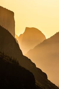 Scenic view of mountains against sky during sunset