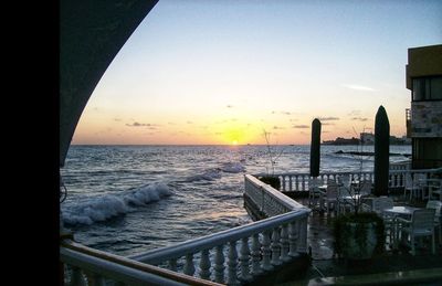 Scenic view of sea against clear sky during sunset