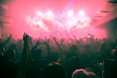 People enjoying music concert at night