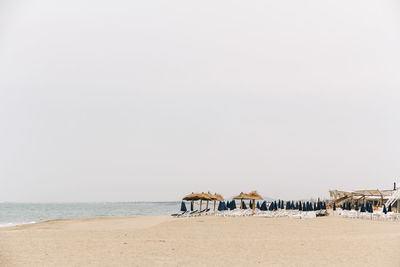 Scenic view of beach against clear sky