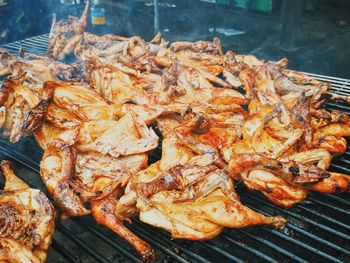 High angle view of meat on barbecue grill