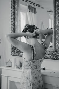 Woman standing at home