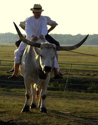 Rear view of man standing on field