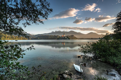 Scenic view of lake against sky during sunset