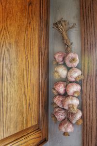 Close-up of flowers hanging on wood