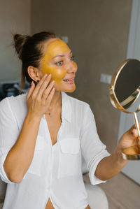 Spa beauty organic facial mask application at day spa home person