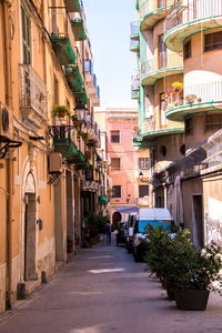 Alley amidst buildings in city