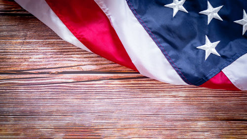 High angle view of flag on wooden table