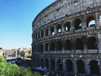 Coliseum against sky in city