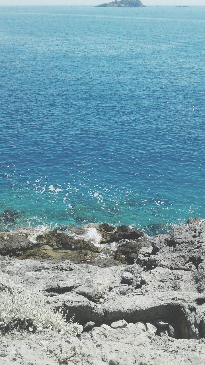 sea, water, beauty in nature, beach, scenics - nature, land, tranquility, nature, horizon over water, horizon, no people, day, tranquil scene, idyllic, outdoors, blue, rock, motion, sky, rocky coastline