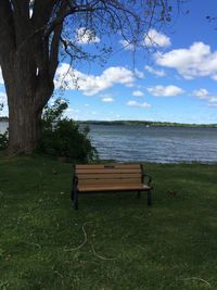 Empty bench on lakeshore