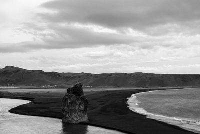 Scenic view of calm lake against mountain range