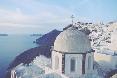 Panoramic view of sea and church against sky