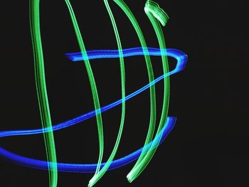 Close-up of light trails against black background