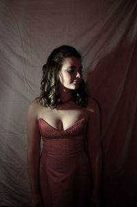 Beautiful young woman lying on bed