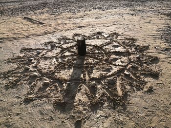 High angle view of shadow on sand