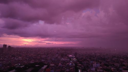 High angle view of city against sky during sunset