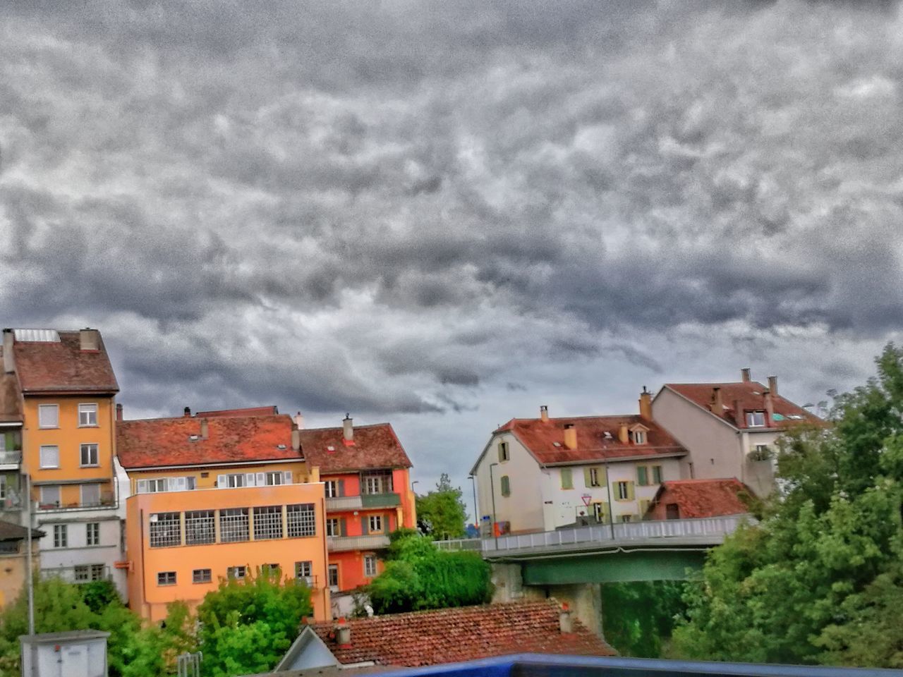 HOUSES IN CITY AGAINST SKY