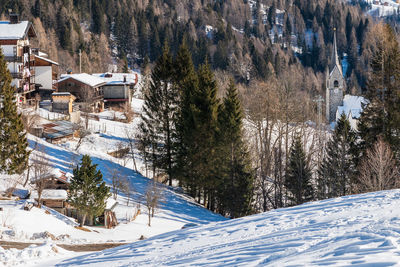 Winter magic. the ancient wooden houses of sauris di sopra. italy