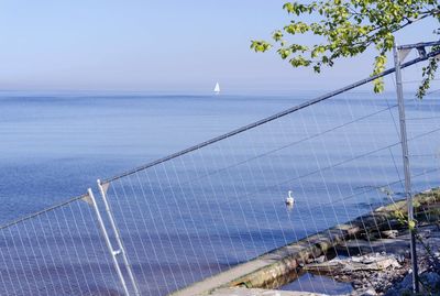 High angle view of swimming pool by sea against sky