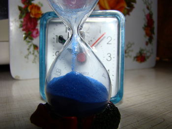 Close-up of clock on table