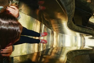 High angle view of woman standing in slide