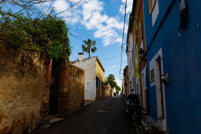 Alley amidst buildings in city