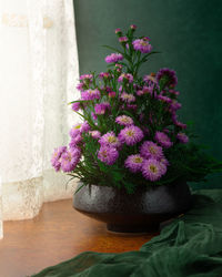 Close-up of pink flower pot on table