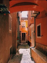 Footpath amidst buildings