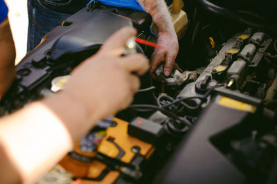 Mechanics repairing car at garage