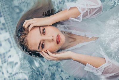 High angle view portrait of woman in swimming pool