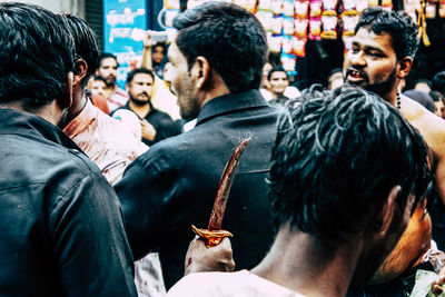 Rear view of people looking at city