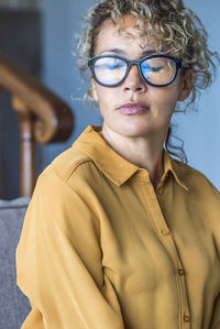 Portrait of young woman wearing eyeglasses