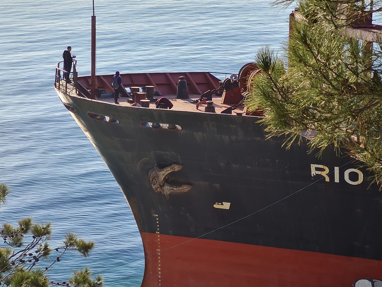 BOATS MOORED IN SEA