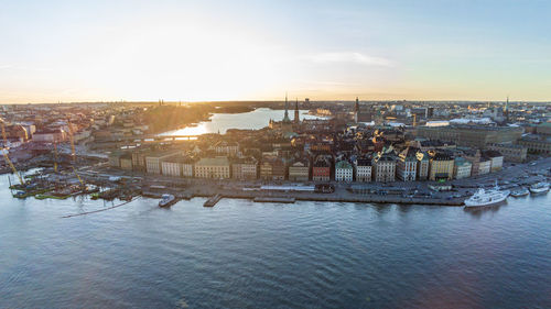 Buildings in city at sunset